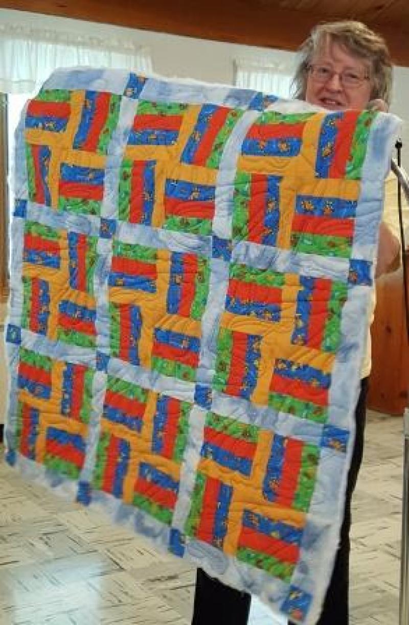 Liz P will give away this baby quilt before our next meeting